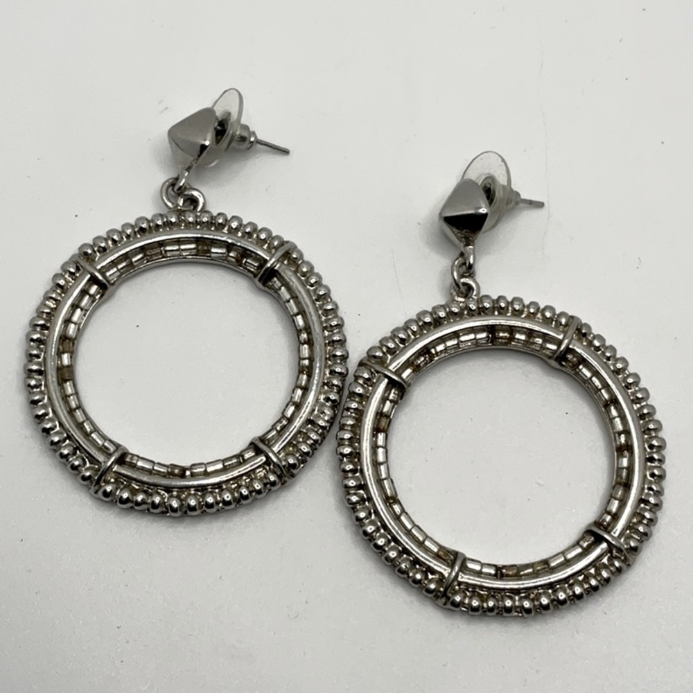 Vintage silver stud earrings w/ dangling hoops. Edgy classy and cool vibe!